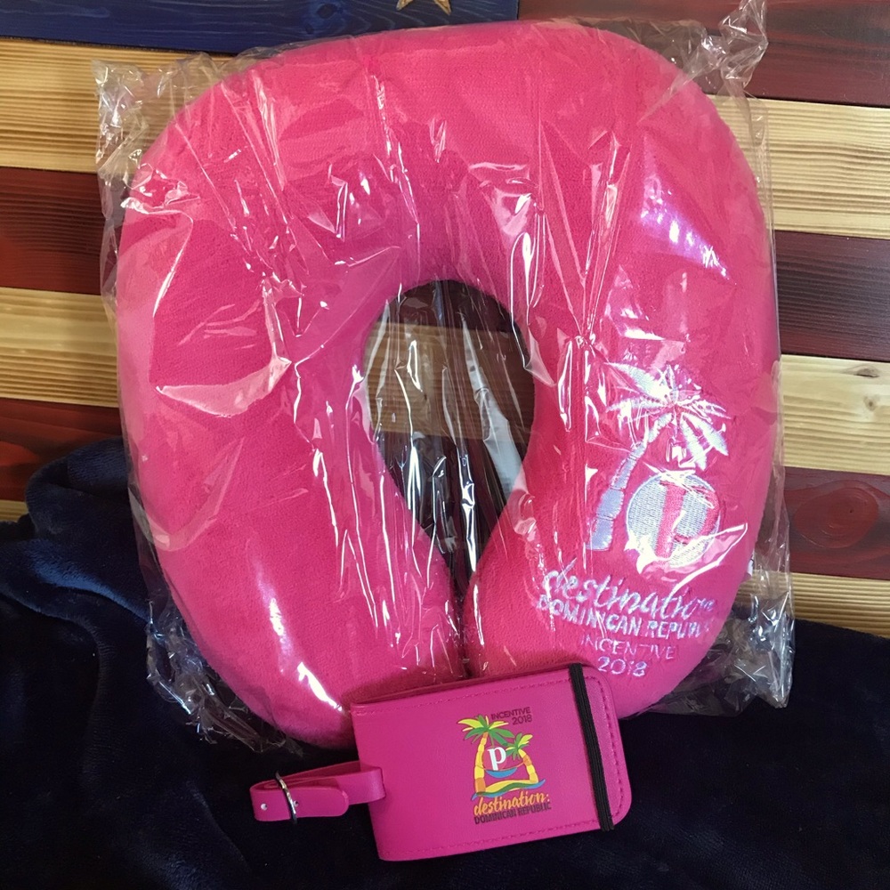 New in plastic, travel pillow and luggage tag